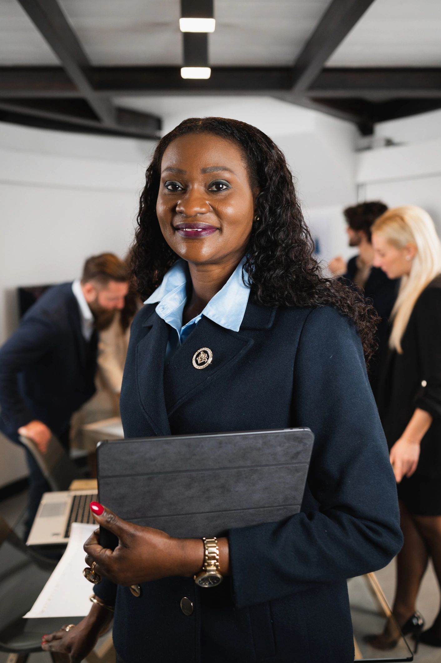 Executive portrait of a senior businesswoman holding a tablet in an office