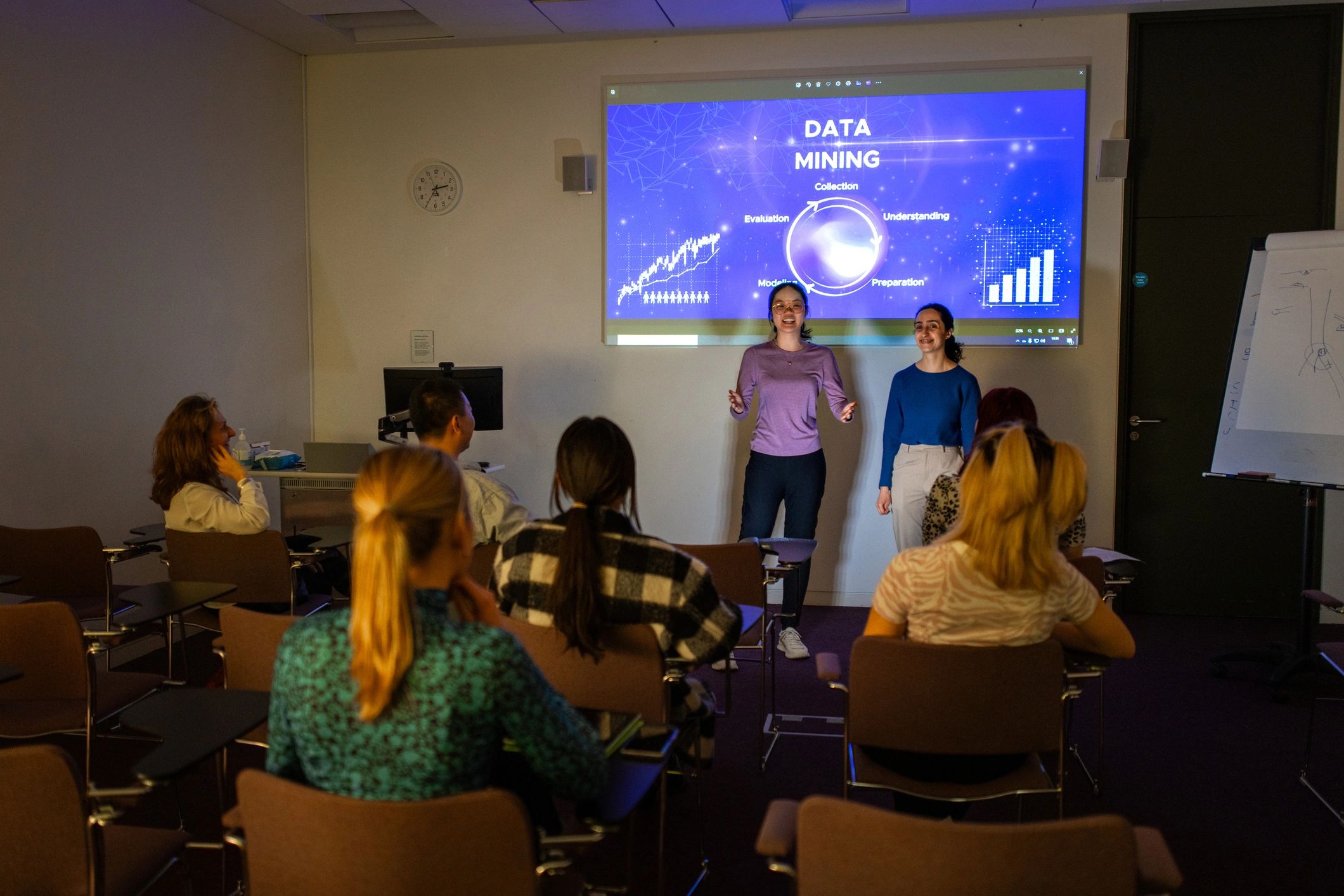 Professionals presenting research findings in a collaborative setting