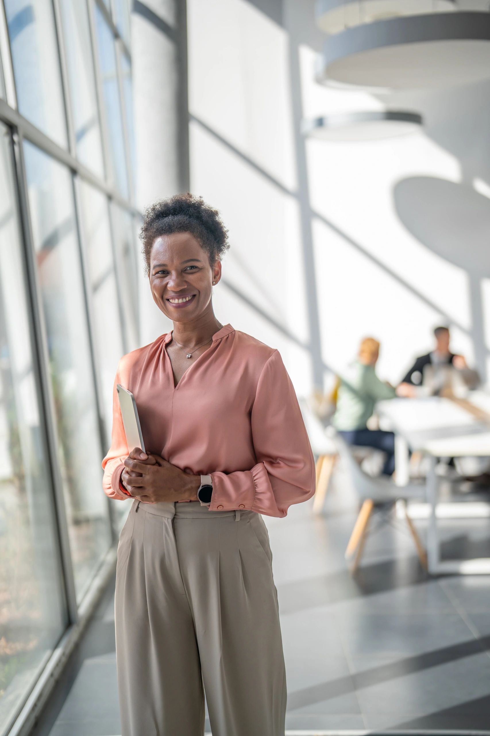 Businesswoman with tablet representing analytics leadership